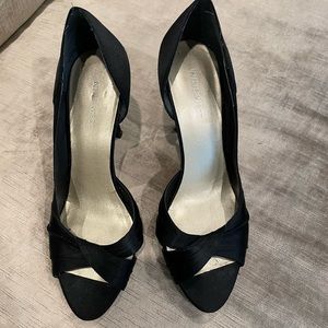 Nine West black satin heel. Size 7 1/2 open toe. Pre-owned good condition